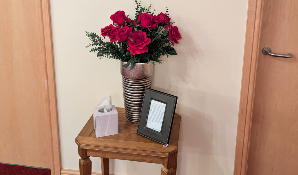 A bouquet of flowers on a table inside Harpin's Funeral Service Outwood branch.